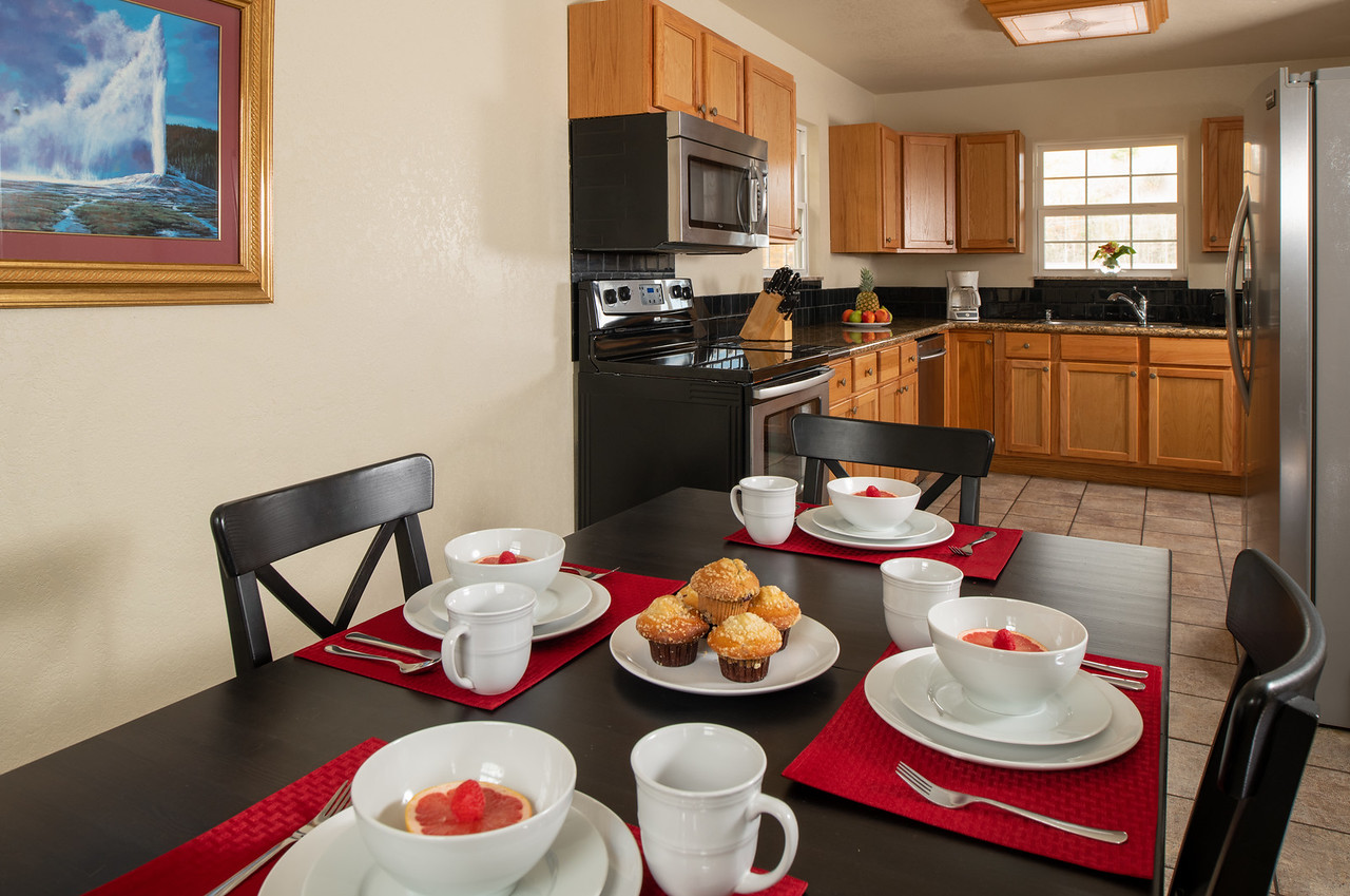 dining table with kitchen in background