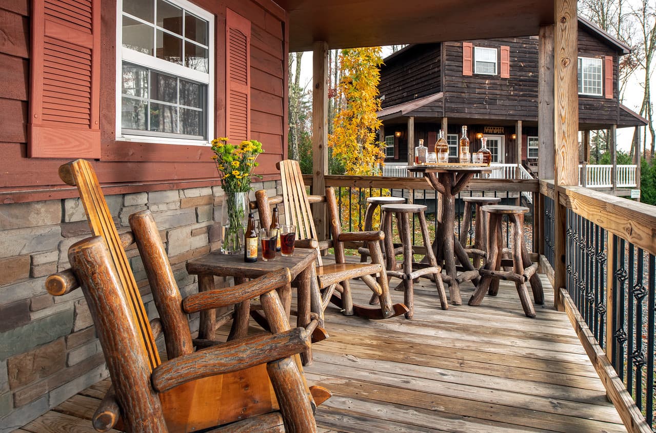 Porch with rustic log crafted rocking chairs