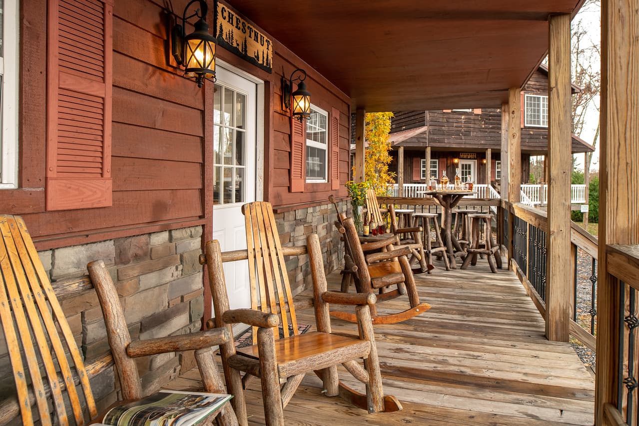 Porch with rustic log crafted rocking chairs