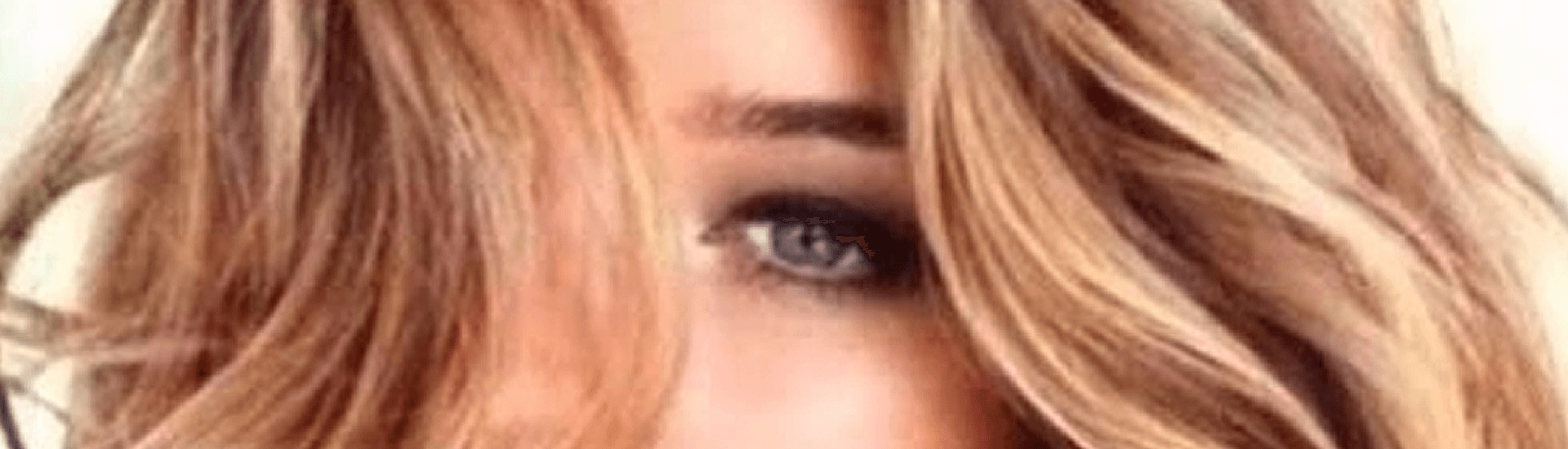 Close up shot of woman with long blond hair covering her right eye